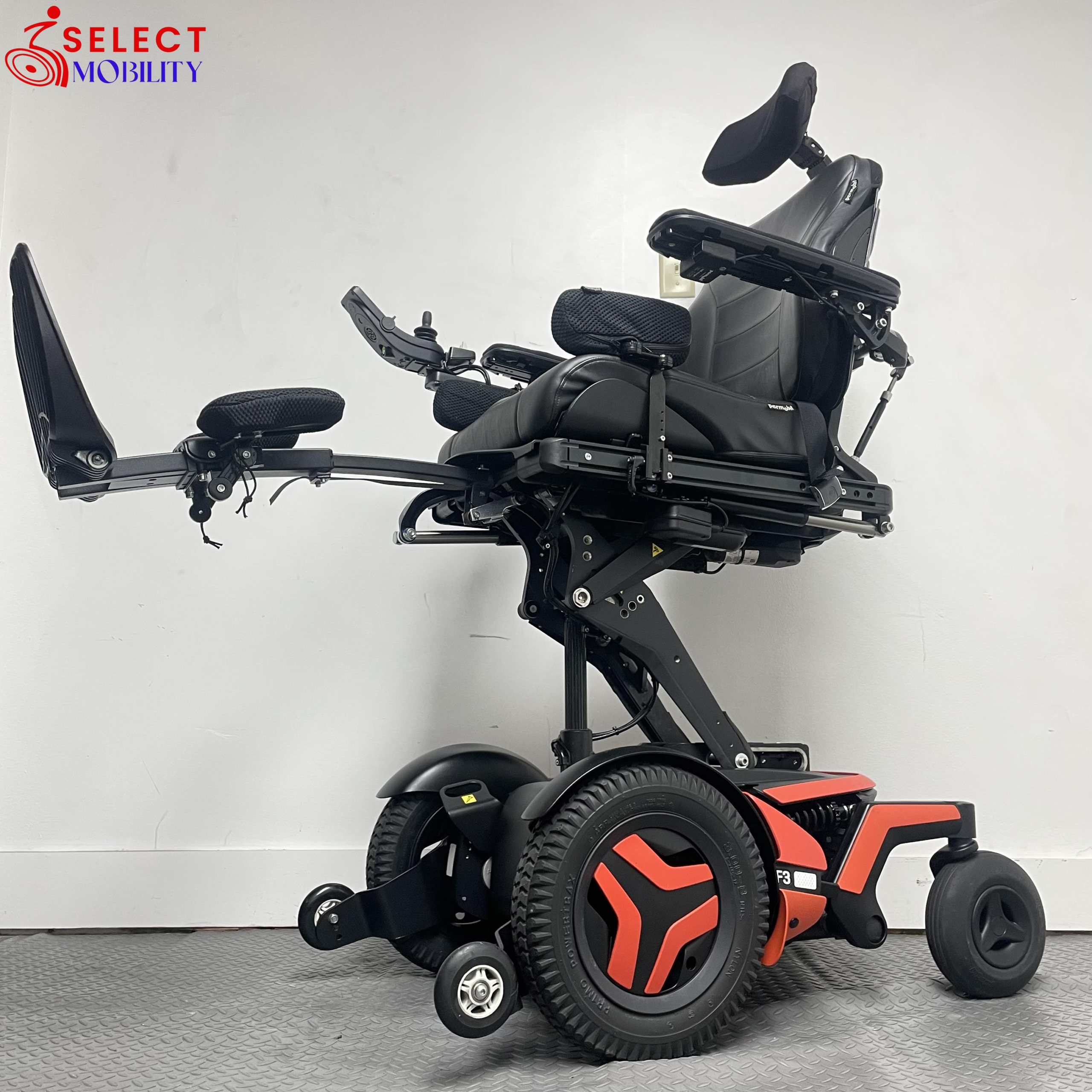 Permobil F3 Corpus power wheelchair demonstrating power lift and legrest elevation